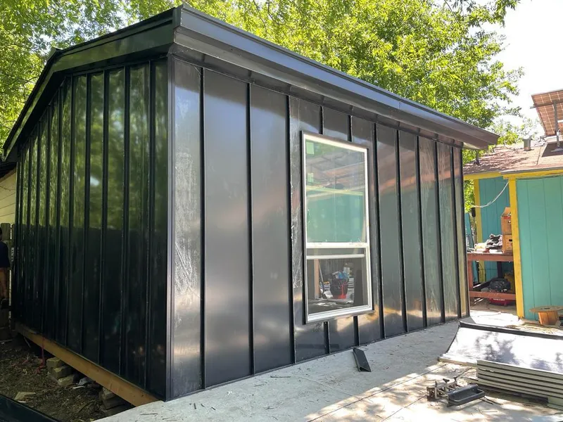 Black standing seam metal wall panels for Roof Inspection in Conroe