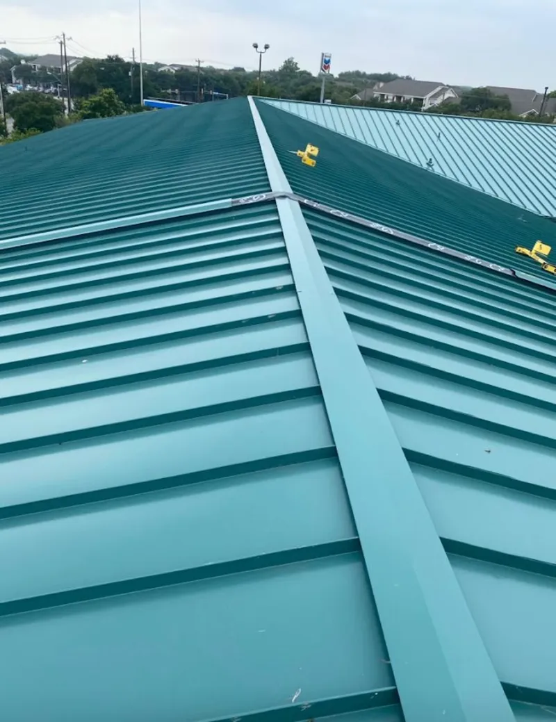 Green commercial metal roof ridge and valley for Metal Roof Repair in Conroe