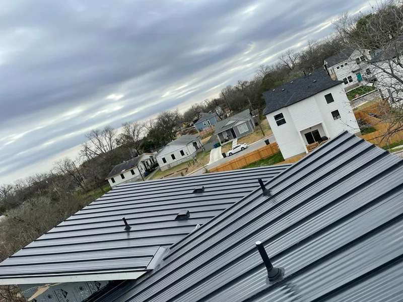 Standing seam metal roof panels with vents for Skylight Repair in Conroe